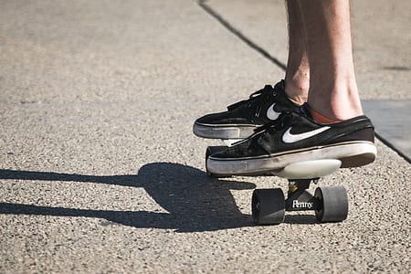 person riding on white Penny board thumbnail