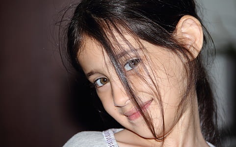 selective focus photography of smiling girl thumbnail