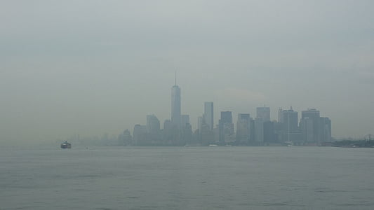 photo of buildings near sea during daytime thumbnail