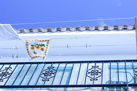 black metal railings on white building thumbnail