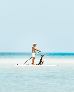 man paddle boating with dog thumbnail