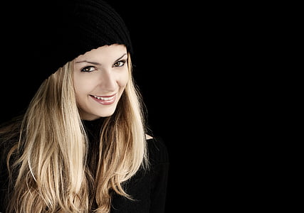 woman wearing black hat smiling thumbnail