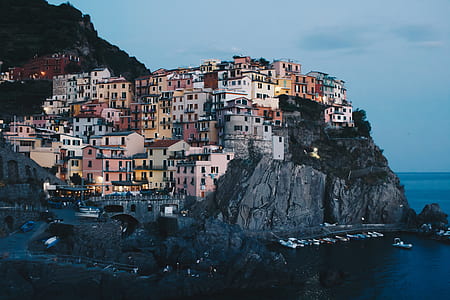 concrete houses beside ocean thumbnail