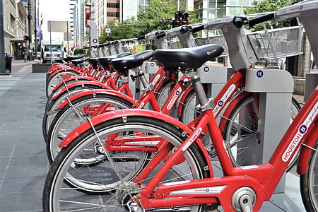 red bicycle parked on parking lot thumbnail