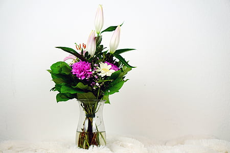 pink and white petaled flowers in clear glass vase thumbnail