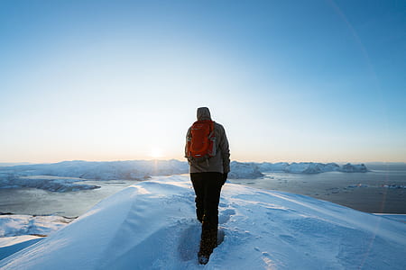 man standing on white snow taken at daytime thumbnail