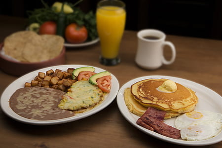 baked pancakes with egg and bacon strip on white ceramic plate thumbnail