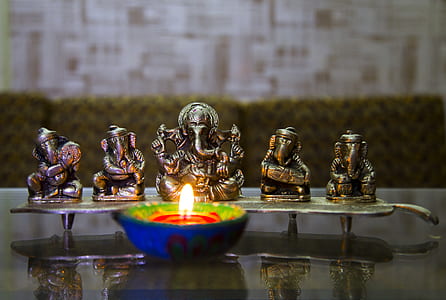 selective focus photography of Ganesha figurine thumbnail