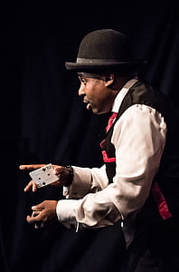 man holding playing card thumbnail