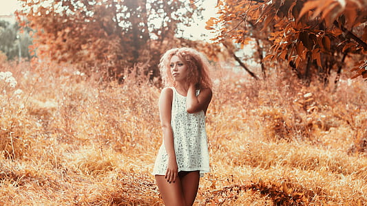 woman wearing white floral tank top thumbnail