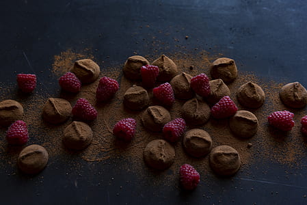 raspberries and chocolate lot on black surface thumbnail