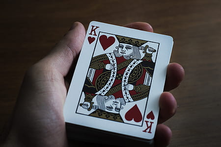 person holding king of heart playing card thumbnail