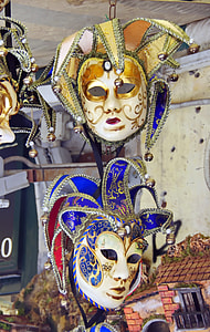 two hanging assorted-color masquerade masks thumbnail