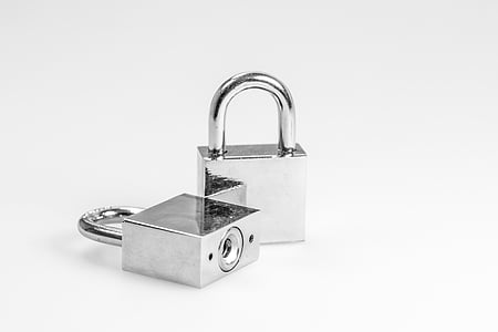 two grey padlocks on white surface thumbnail