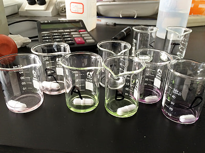 white measuring cups on black surface thumbnail