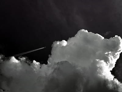 Grayscale Photo Of Plane In The Sky thumbnail