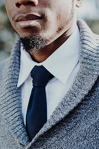 man wearing white dress shirt and gray cardigan thumbnail