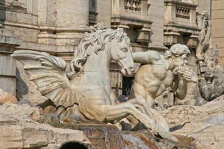pegasus beside man sculptures thumbnail