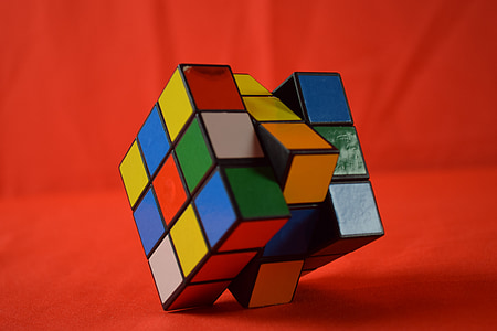 rubick's cube on red cloth thumbnail