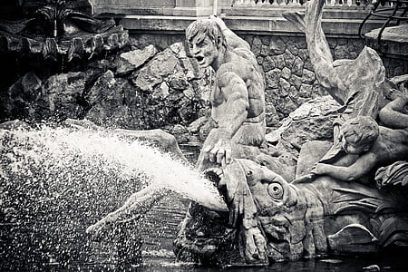 people opening mouth of animal statue thumbnail