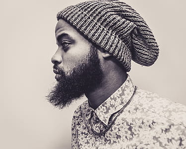 Man Wearing Knit Hat And Collared Shirt thumbnail