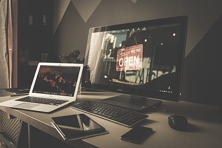 black flat screen computer monitor and gray laptop computer thumbnail