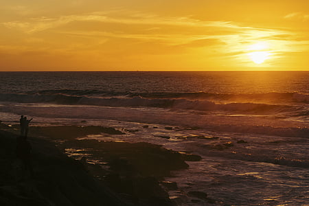 two person facing sunset thumbnail