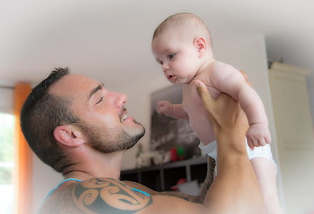 man holding baby thumbnail