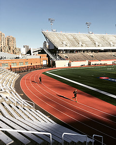 human running on track field thumbnail