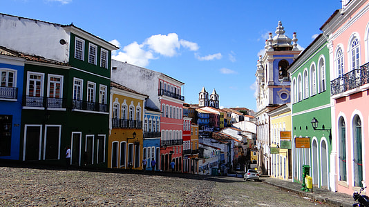 multicolored building under blue and white cloudy sky thumbnail