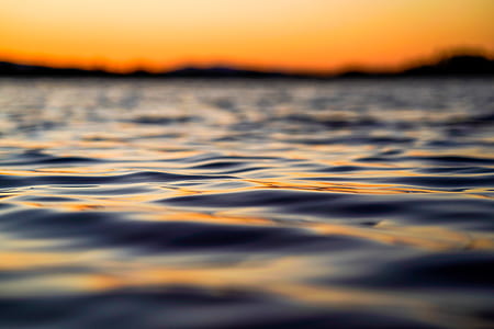 shallow focus of ocean during sunset thumbnail