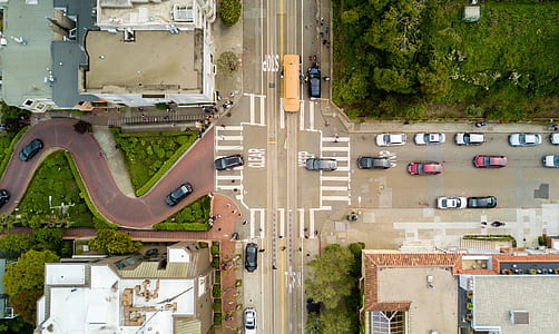 aerial photo of vehicles cruising on road during daytime thumbnail