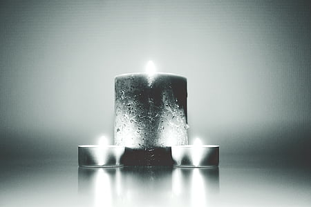 grayscale photo of three candles thumbnail