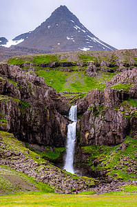waterfall beside mountain thumbnail