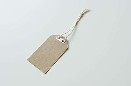 brown tag on white surface thumbnail