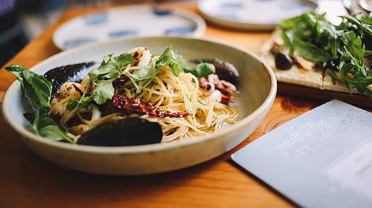 yellow pasta noodle under of green vegetables thumbnail