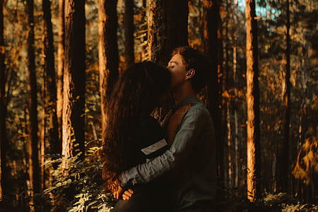 man and woman hugging in the forest thumbnail