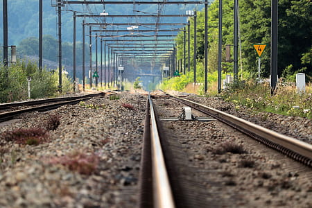 selective focus photography of railroad thumbnail