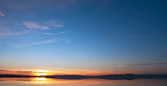 selective photography of sunset thumbnail