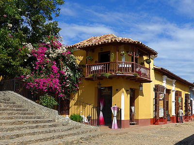 yellow and red concrete house at daytime thumbnail