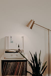 white turntable next to floor lamp thumbnail
