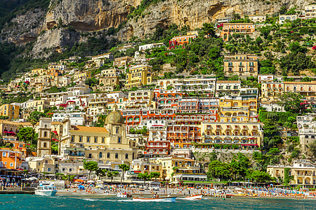 aerial photography of assorted-color of houses on hill near ocean during daytime thumbnail