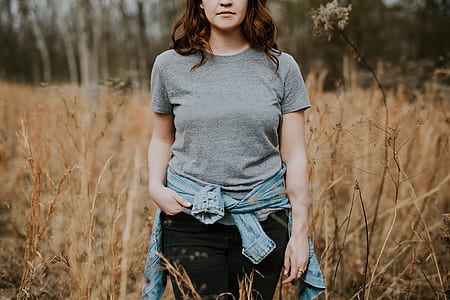 woman standing in beige grass thumbnail