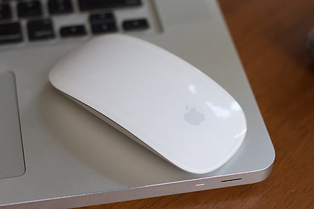 photo of Apple Magic Mouse on top of laptop thumbnail