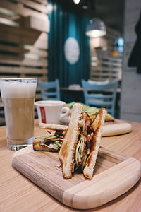 selective focus photography of sandwich on brown board thumbnail