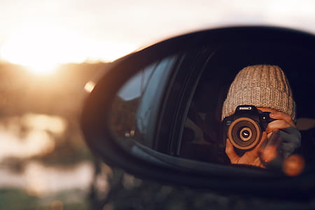 person using DSLR camera thumbnail