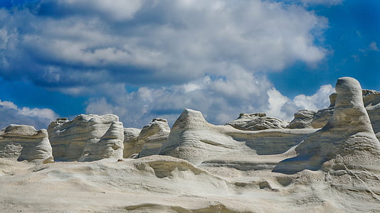 white sand with rock formation thumbnail