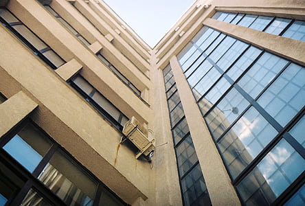 low angle photo of white concrete building thumbnail