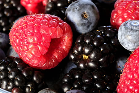 raspberries and blueberries on gray surface thumbnail