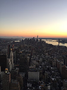 aerial photography of metropolitan scraper near sea at daytime thumbnail